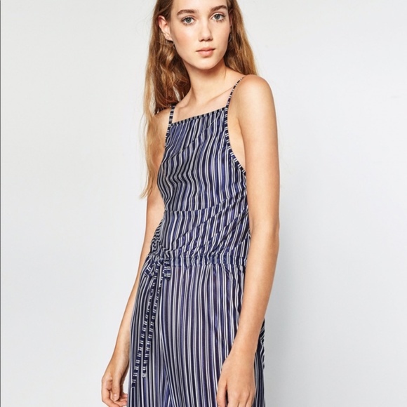 white and navy striped jumpsuit